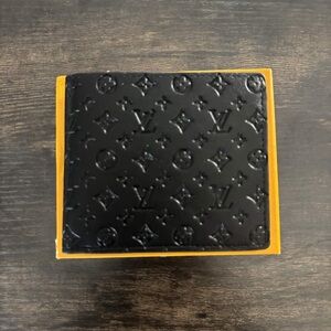 Authentic gently used Louis Vuitton Black Embossed Monogram